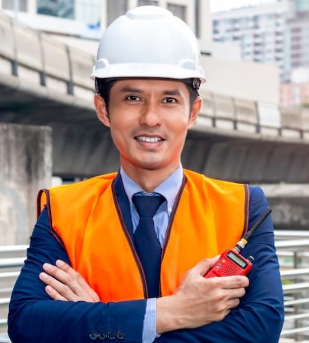 asian-thoughtful-engineer-smiling-with-arms-crossed_53255-1249