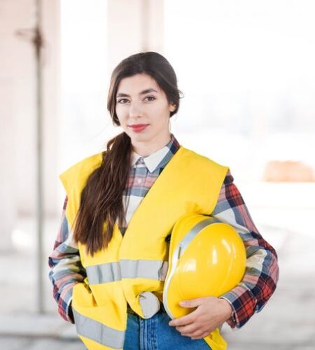female-engineer-stands-construction-site-holding-hardhat-hand_153608-1219